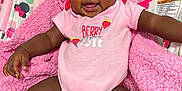 Kyomi is registered to the contest to win money with this photo: baby, child, infant, pink_clothing, onesie, smiling, happy, cute, baby_chair, minnie_mouse, blanket, hand, skin, sitting, indoor, portrait, comfort, toddler, playful, expression