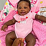 baby, child, infant, pink_clothing, onesie, smiling, happy, cute, baby_chair, minnie_mouse, blanket, hand, skin, sitting, indoor, portrait, comfort, toddler, playful, expression