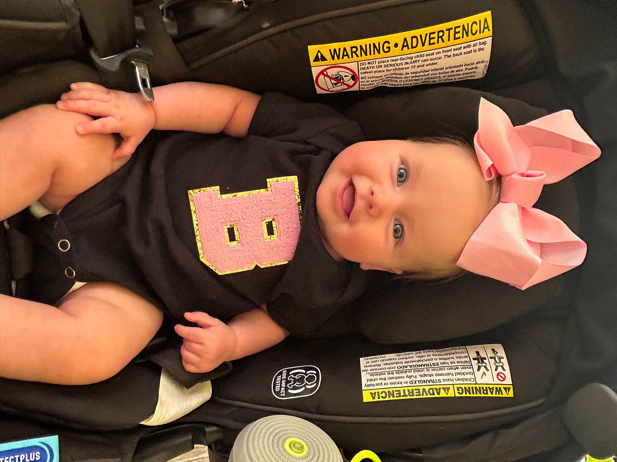 Brooklynn is registered to the contest to win money with this photo: auto_part, baby_products, baby_toddler_clothing, car_seat, carmine, cheek, child, comfort, fashion_accessory, gesture, happy, joy, nail, person, sleeve, smile, stuffed_toy, thumb, toddler, toy