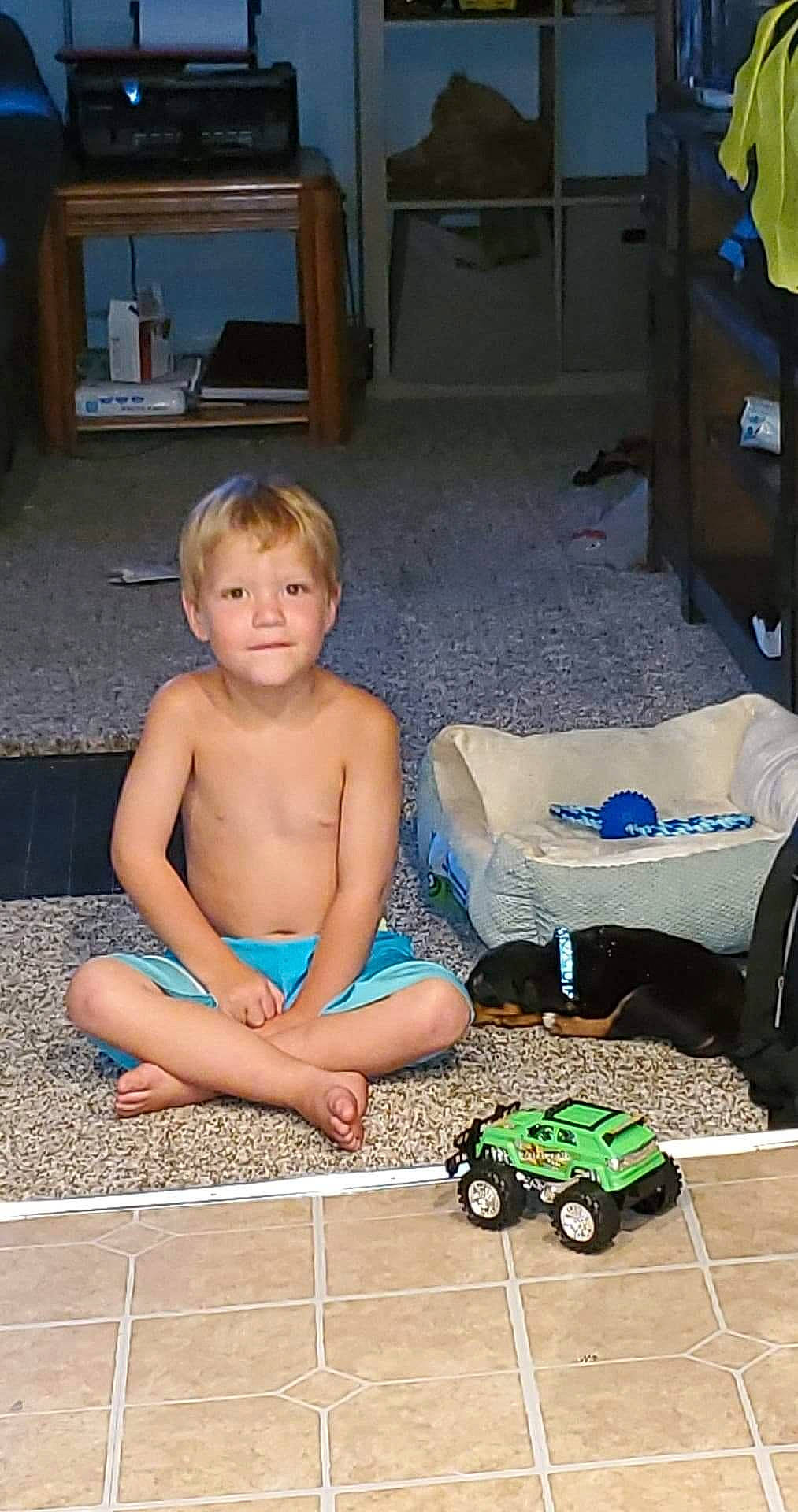 Kameron joined the competition — help win amazing prizes! automotive_tire, baby, barechested, barefoot, blue, chair, child, floor, flooring, foot, fun, green, hairstyle, human_body, leisure, person, sitting, tire, toddler, wheel