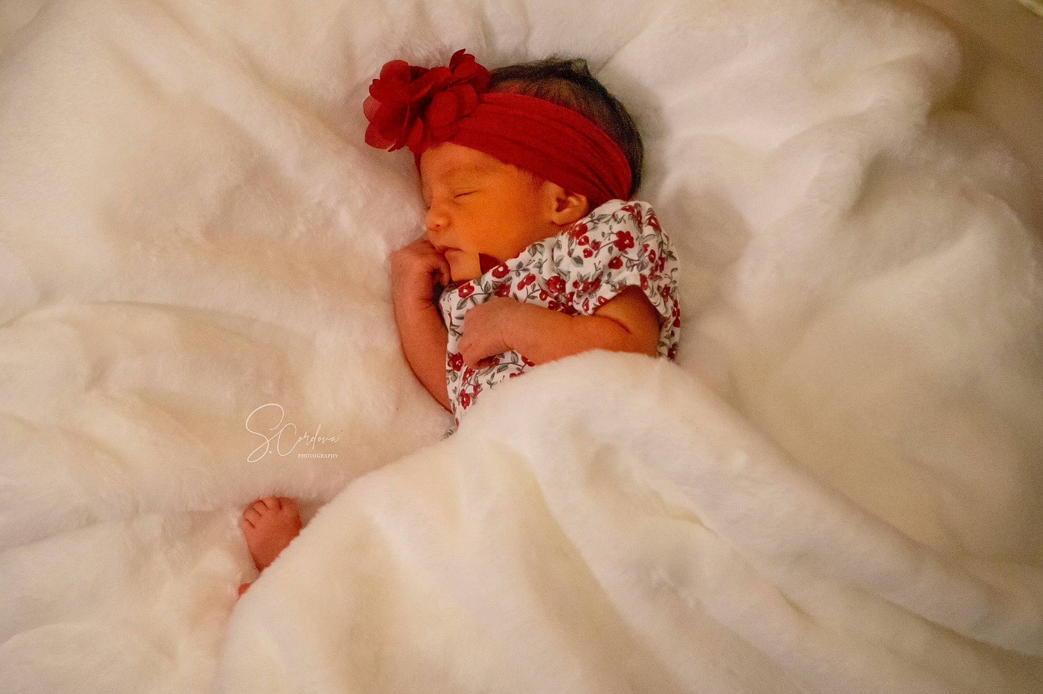 Valentina is registered to the contest to win money with this photo: arm, baby, baby_sleeping, baby_toddler_clothing, bed, bedding, bedtime, child, comfort, dress, event, eye, fashion_accessory, fur, headwear, human_body, linens, peach, person, portrait_photography