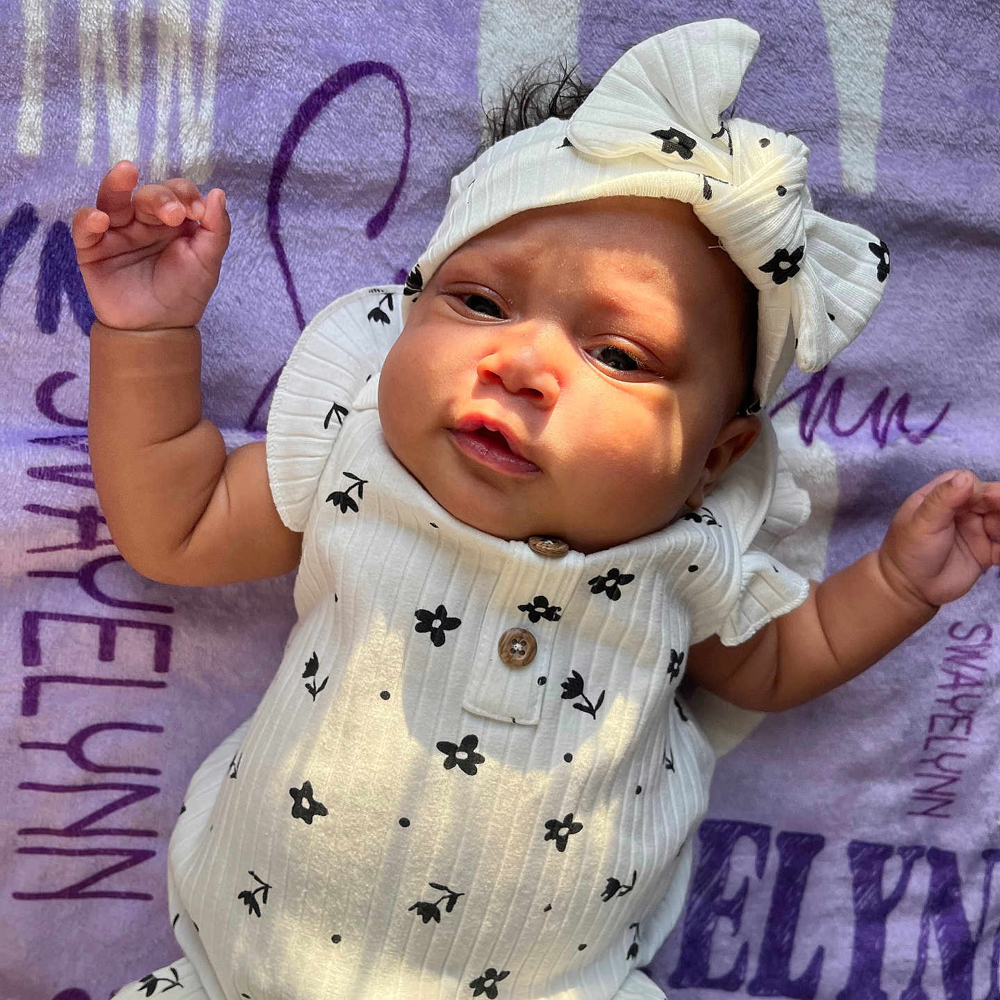 Swayelynn is registered to the contest to win money with this photo: baby, blanket, bodypart, bonnet, cap, clothing, face, finger, hand, happy, hat, head, newborn, person, photography, portrait, purple, quilt, smile, t_shirt