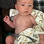 Bradley is registered to the contest to win money with this photo: baby, infant, blanket, animal_print, pacifier, skin, face, hand, leg, cozy, cushion, comfort, expression, indoors, child, newborn, portrait, soft_texture, resting, cute