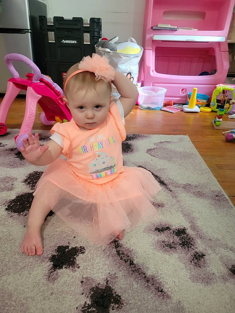 Amariana is registered to the contest to win money with this photo: baby, baby_products, baby_toddler_clothing, child, event, flooring, foot, fun, happy, home_appliance, human_leg, magenta, paper_towel, party, person, pink, play, purple, room, sitting