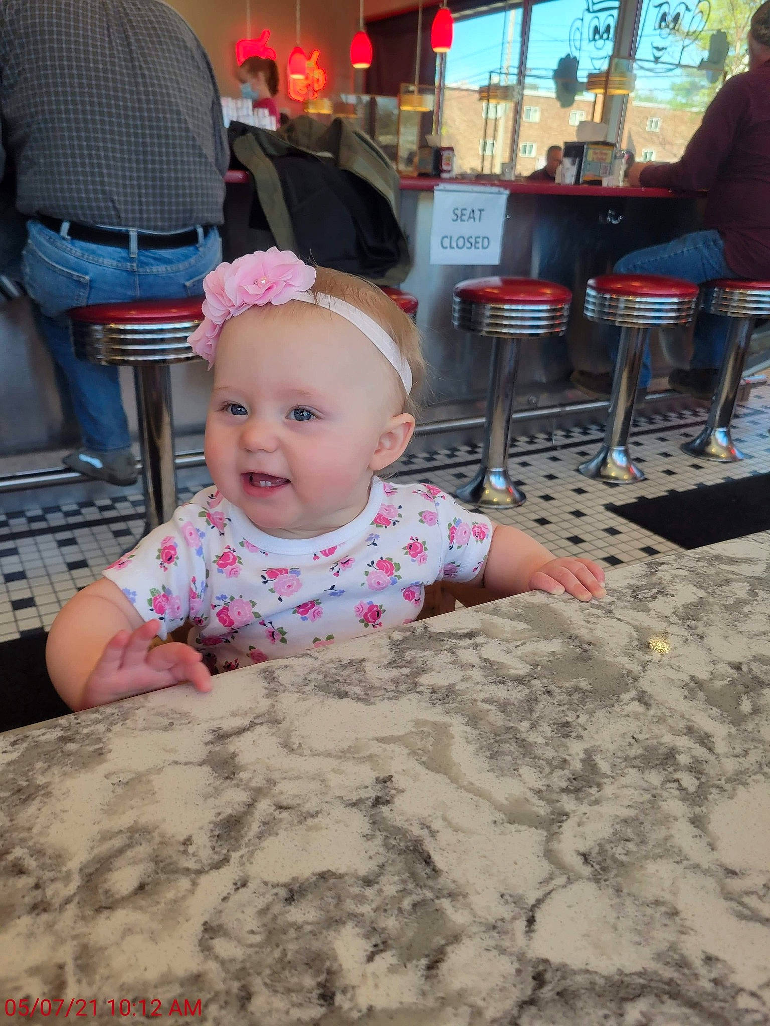 Amariana is registered to the contest to win money with this photo: baby, baby_toddler_clothing, chair, child, floor, flooring, fun, hairstyle, happy, hat, leisure, person, pink, product, public_space, sitting, skin, sleeve, smile, t_shirt