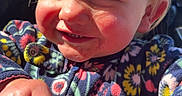 Everlee joined the competition — help win amazing prizes! baby, child, closeup, clothing, colorful, cute, face, fleece, floral_pattern, hair, hands, happy, holding_object, messy_hair, outdoor, person, playful, smiling, sunlight, toddler