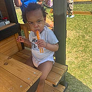 Mayson is registered to the contest to win money with this photo: backyard, barefoot, bench, child, clothing, family, fun, grass, happy, kids, outdoor, person, play, playground, popsicle, summer, sunlight, swing, toddler, wooden_furniture