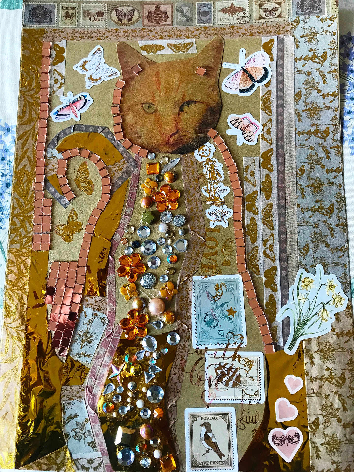 Marley a rejoint le concours — aidez-le/la à gagner de superbes lots ! cat, collage, craft, jewels, stickers, butterfly, postage_stamp, flower, vintage, decorative, artwork, paper, texture, heart, bird, orange, brown, gold, handmade, design
