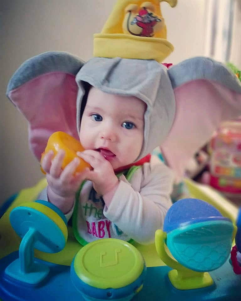 Gianna joined the competition — help win amazing prizes! baby, baby_playing_with_toys, baby_products, baby_toddler_clothing, baby_toys, cap, child, costume_hat, drinkware, event, fictional_character, fun, happy, headwear, party_supply, person, plastic, play, product, toddler