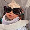 baby, child, sunglasses, knitted_hat, blanket, smile, cozy, warm_clothing, infant, portrait, cute, soft_texture, indoor, closeup, happy, wrapped, fashion, baby_boy, accessories, seat