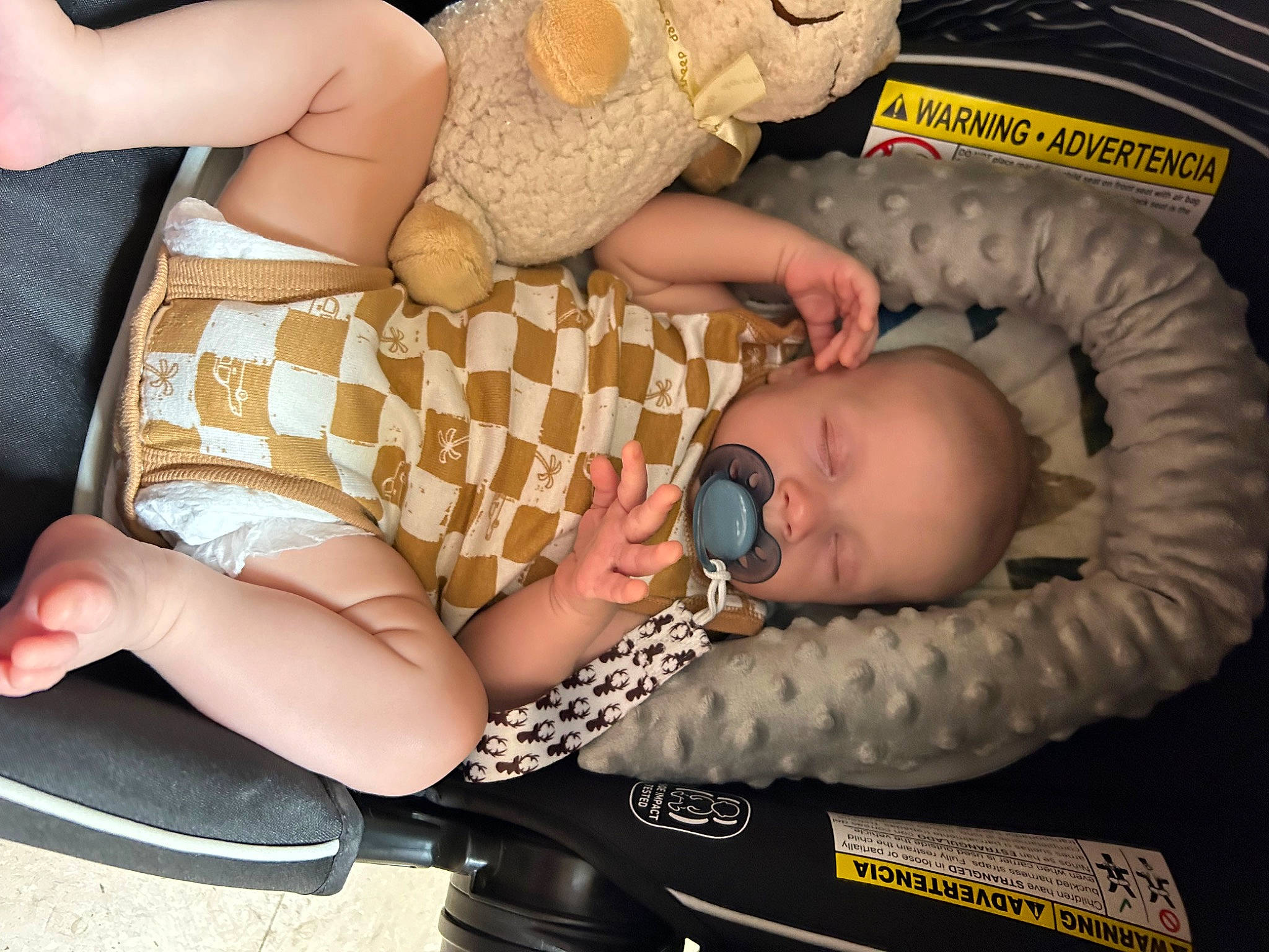 Tucker is registered to the contest to win money with this photo: abdomen, baby, baby_products, baby_toddler_clothing, chest, child, comfort, eyewear, finger, foot, human_leg, joint, nail, organ, pattern, person, skin, thigh, thumb, toddler