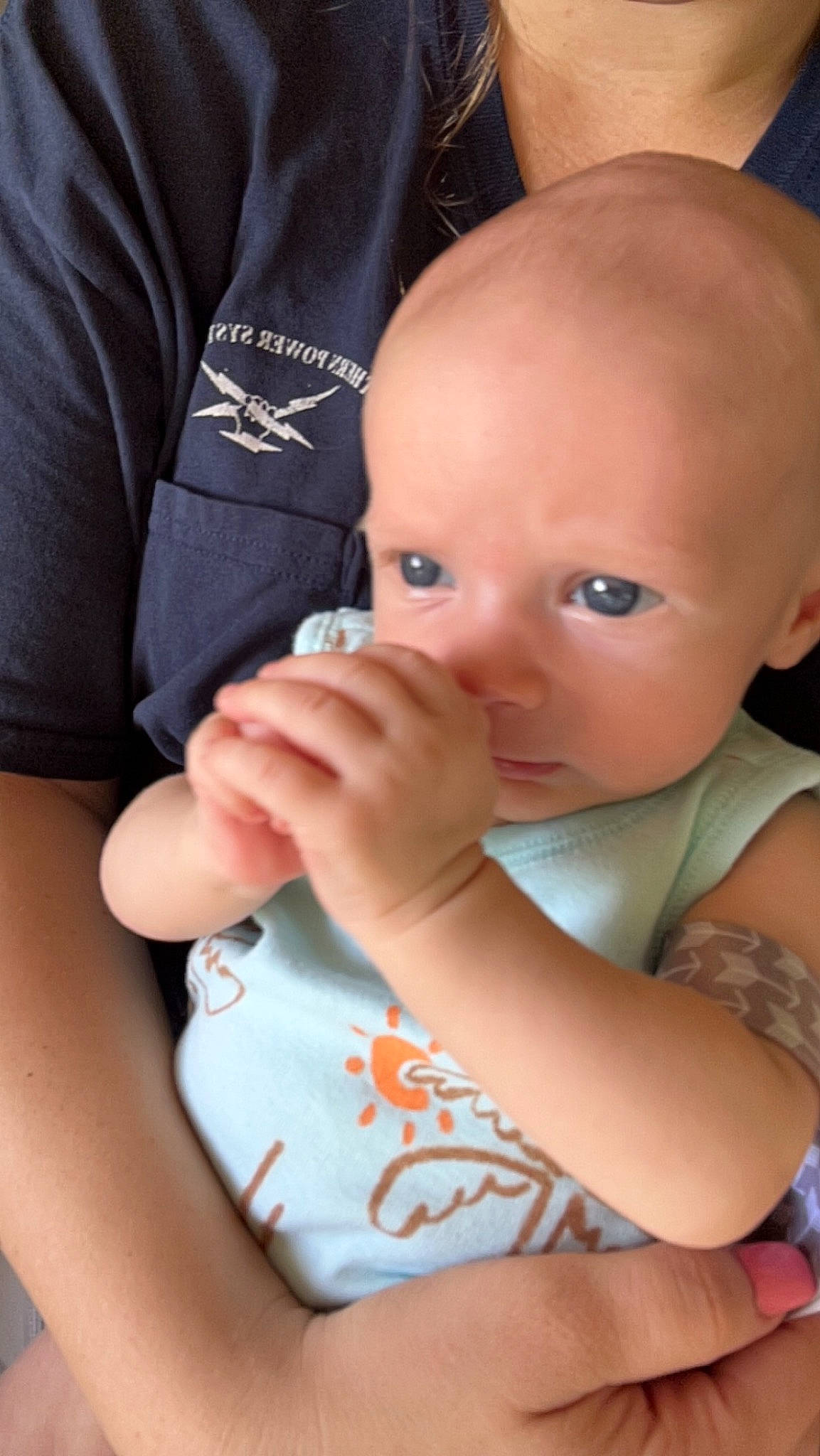 Tucker is registered to the contest to win money with this photo: baby, baby_toddler_clothing, cheek, chin, elbow, eye, finger, gesture, hand, happy, iris, joint, lip, mouth, nail, nose, person, skin, sleeve, thumb