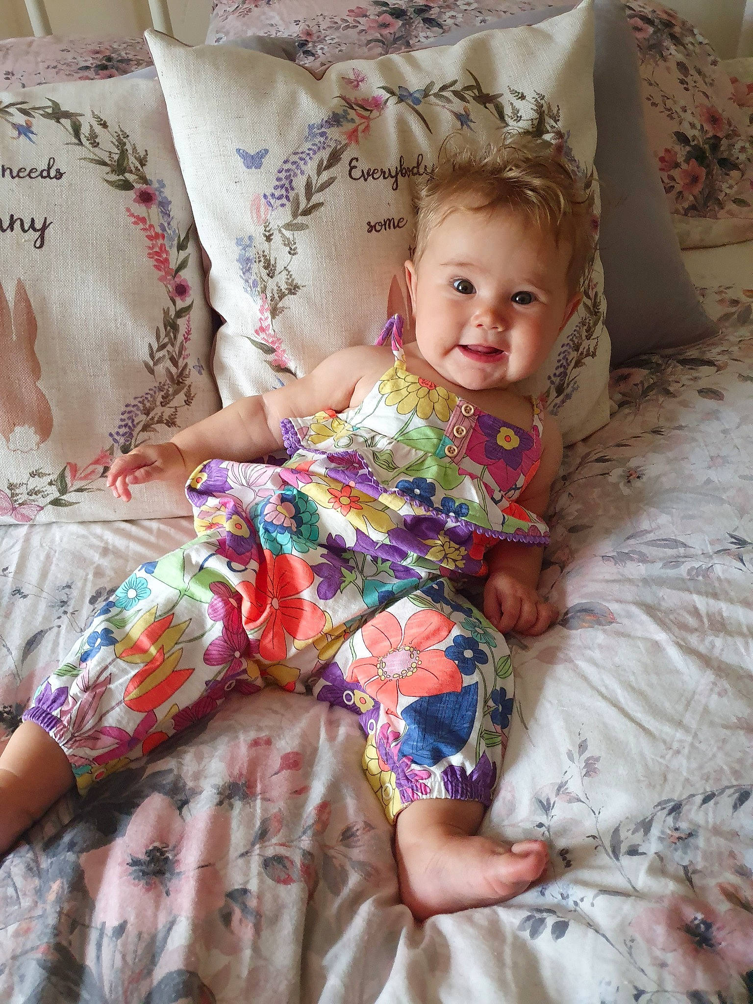 Connie is registered to the contest to win money with this photo: baby, child, linens, pattern, person, textile, toddler