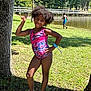 Araelynn Burkett is registered to the contest to win money with this photo: child, girl, swimsuit, peace_sign, tree, grass, pond, bridge, fishing, boy, summer, outdoor, nature, sunlight, playful, smile, slippers, wristband, park, water