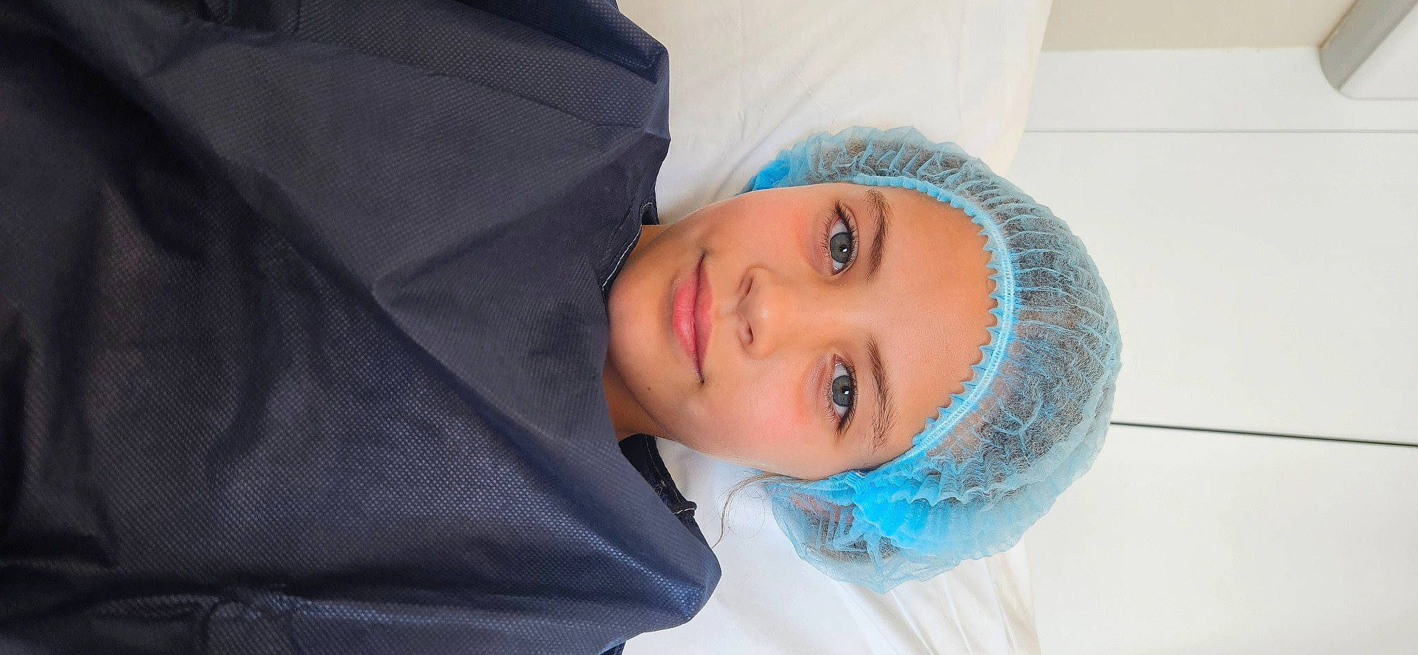 Lya participe au concours pour gagner de l'argent avec cette photo : cheek, child, comfort, electric_blue, eyelash, fashion_accessory, flash_photography, fun, happy, headwear, joy, lip, neck, nose, person, portrait_photography, sleeve, smile, winter