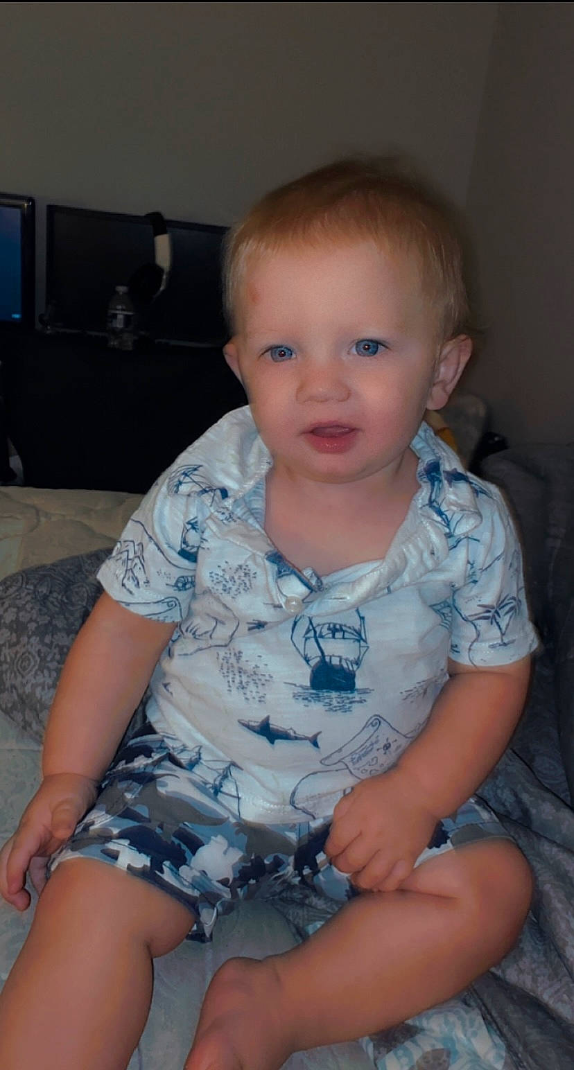 Rivers is registered to the contest to win money with this photo: arm, baby_toddler_clothing, cheek, chin, cool, eye, eyebrow, finger, iris, joint, leg, lip, mouth, muscle, neck, nose, person, shoulder, skin, sleeve