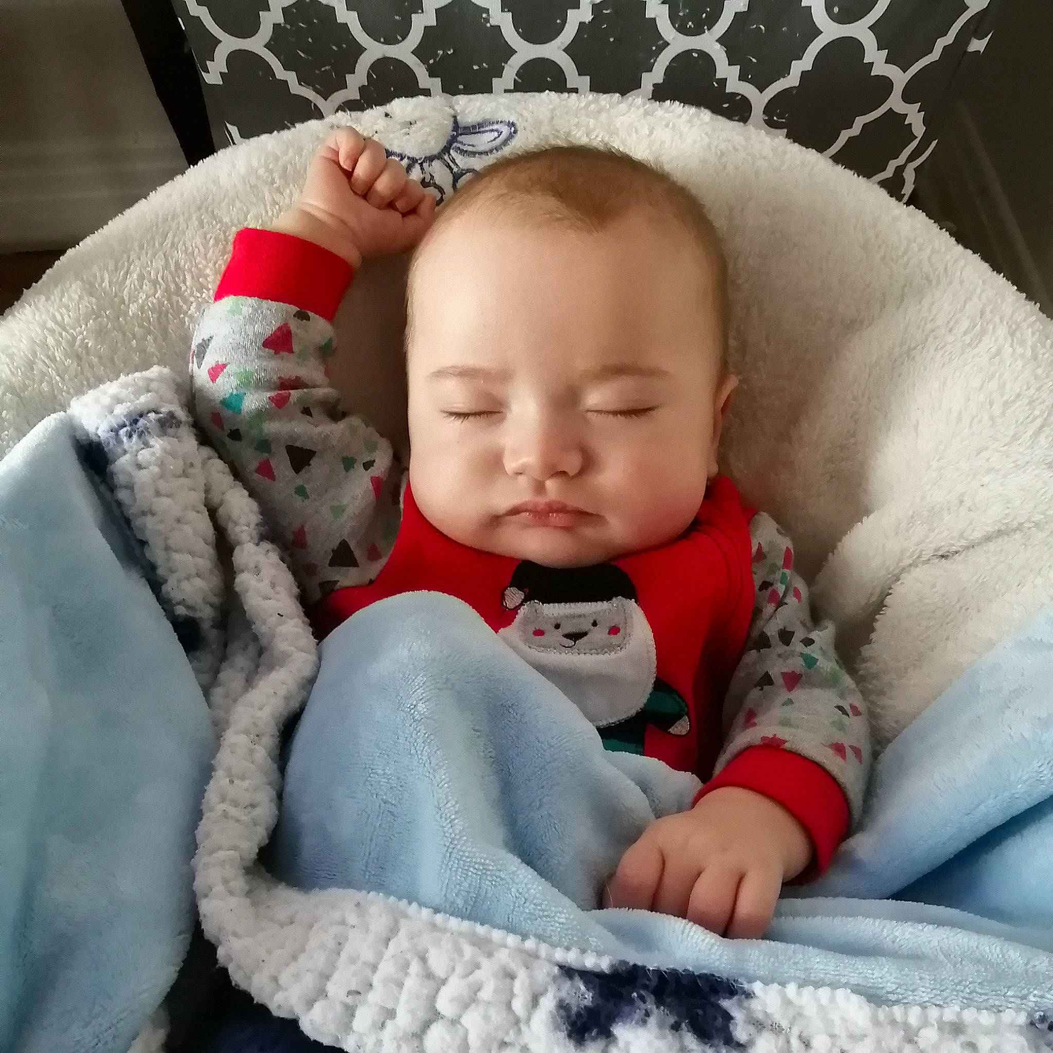 Mason participe au concours pour gagner de l'argent avec cette photo : baby, baby_products, baby_sleeping, baby_toddler_clothing, cheek, child, comfort, couch, eye, face, head, knit_cap, linens, pattern, person, sitting, skin, sleeve, textile, toddler