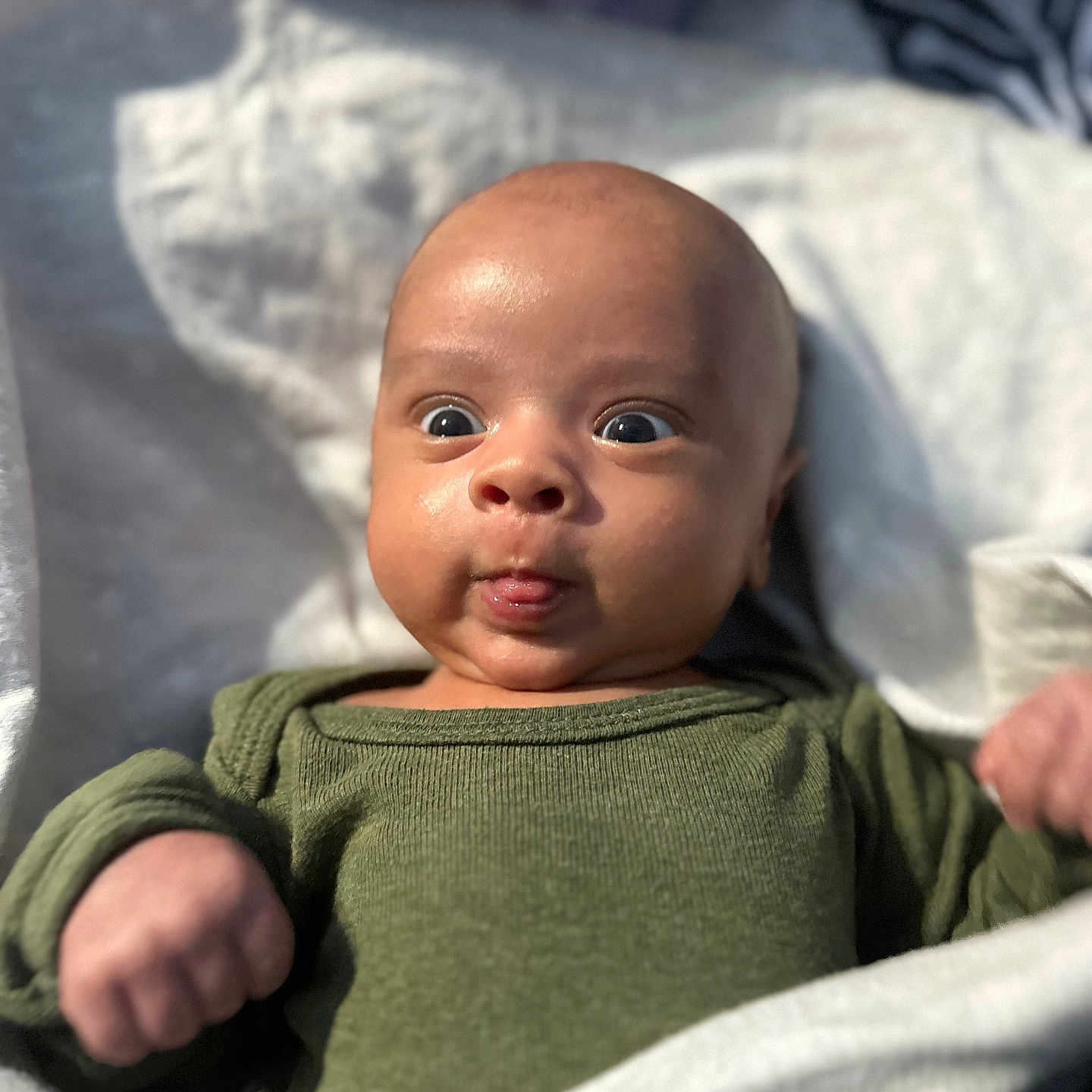 Yusuf is registered to the contest to win money with this photo: baby, bodypart, clothing, cushion, face, finger, hand, happy, head, homedecor, knitwear, longsleeve, newborn, person, photography, portrait, sleeve, smile, sweater, t_shirt