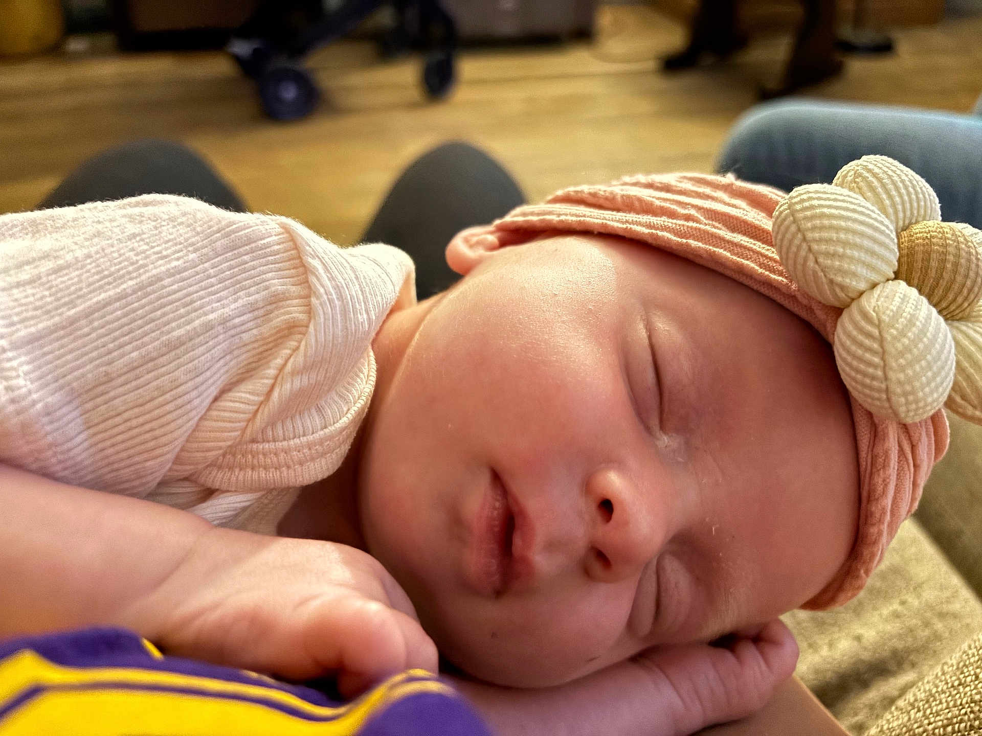 Bailee Rockholt is registered to the contest to win money with this photo: baby, sleeping, headband, flower, pink, newborn, infant, closeup, peaceful, soft, skin, hand, resting, indoors, cozy, warm_light, portrait, cute, child, peaceful_sleep