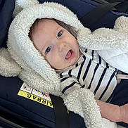Kaycee participe au concours pour gagner de l'argent avec cette photo : arm, baby, blanket, blue, buckle, car_seat, child, close_up, cozy, drooling, eyes, face, hooded_blanket, infant, navy, open_mouth, plush_texture, portrait, safety_label, striped_onesie