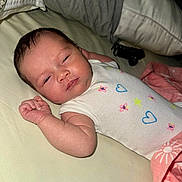 Litzianna is registered to the contest to win money with this photo: baby, bed, blanket, child, clothing, cute, fabric, face, hand, indoors, infant, newborn, onesie, peaceful, person, pillow, pink, skin, sleeping, white
