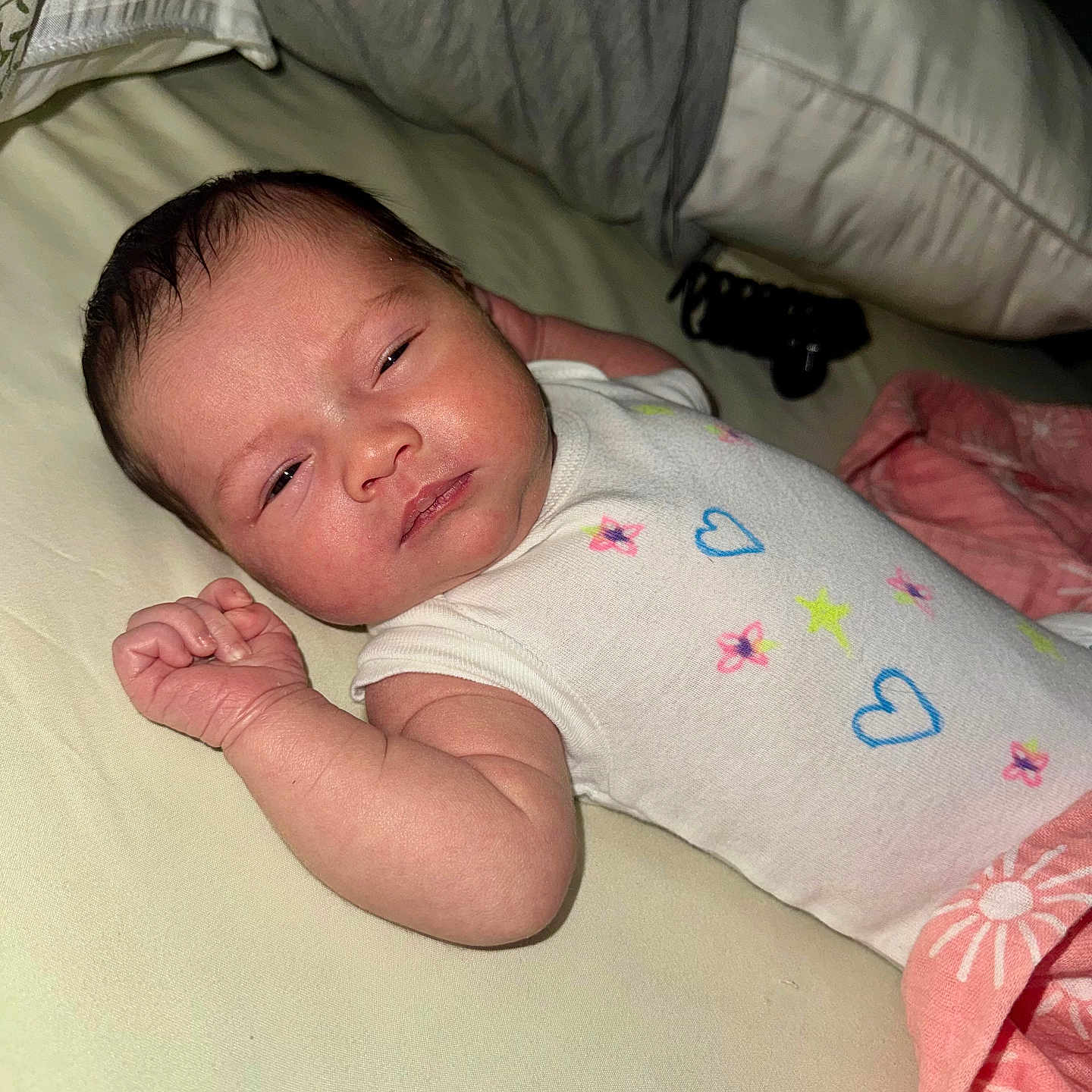 Litzianna is registered to the contest to win money with this photo: baby, bed, blanket, child, clothing, cute, fabric, face, hand, indoors, infant, newborn, onesie, peaceful, person, pillow, pink, skin, sleeping, white
