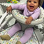 Cataleya joined the competition — help win amazing prizes! baby, infant, smiling, happy, sitting, baby_seat, lilac_clothing, socks, curly_hair, face, hand, toy, playmat, patterned_fabric, indoor, child, cute, expression, mood, young_child