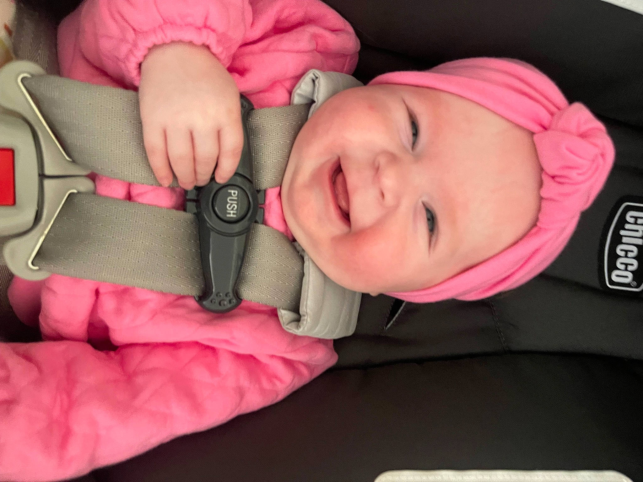 Aubrey is registered to the contest to win money with this photo: baby, baby_laughing, baby_toddler_clothing, cheek, comfort, cool, eyebrow, eyelash, finger, happy, head, headwear, human_body, lip, mouth, nose, person, pink, skin, sleeve