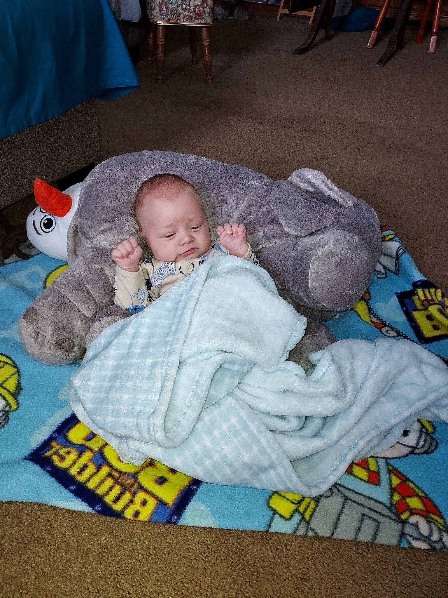 Ryan is registered to the contest to win money with this photo: baby, baby_carriage, baby_products, baby_toddler_clothing, bedtime, blue, child, comfort, flooring, fun, grass, lap, leisure, linens, nap, person, room, sitting, sleep, textile