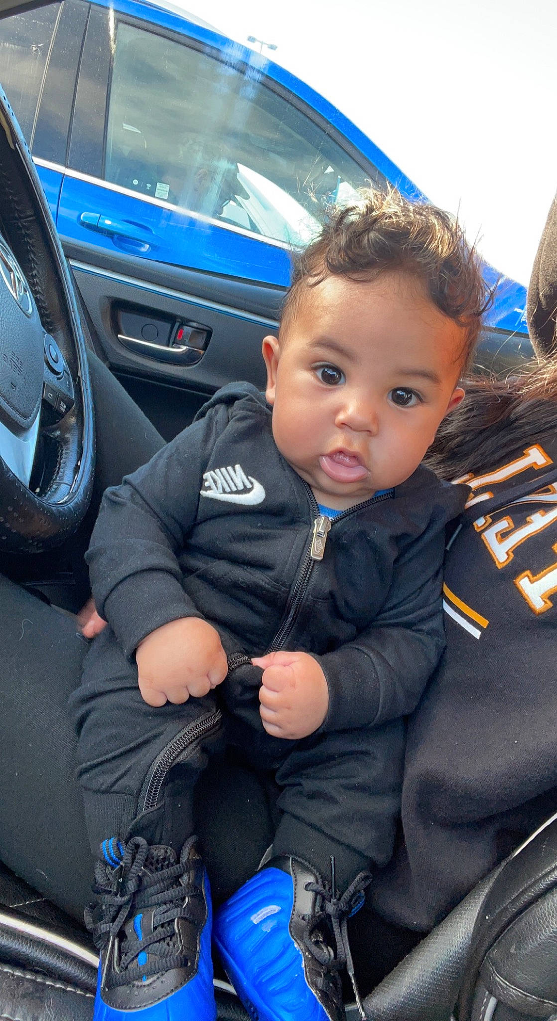 Sultan Jr is registered to the contest to win money with this photo: auto_part, automotive_design, automotive_exterior, automotive_tire, automotive_wheel_system, blue, car, car_seat, car_seat_cover, electric_blue, family_car, mode_of_transport, motor_vehicle, person, personal_luxury_car, steering_part, steering_wheel, toddler, vehicle, vehicle_door