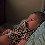 Maielynn joined the competition — help win amazing prizes! baby, infant, pacifier, leopard_print, clothing, bed, blanket, indoors, portrait, child, cute, sleepwear, resting, young, person, skin, head, face, lying_down, comfort