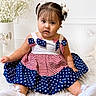 toddler, child, girl, dress, pigtails, bows, stars, stripes, red, white, blue, sitting, indoor, portrait, cute, flower, decor, soft, curious, baby