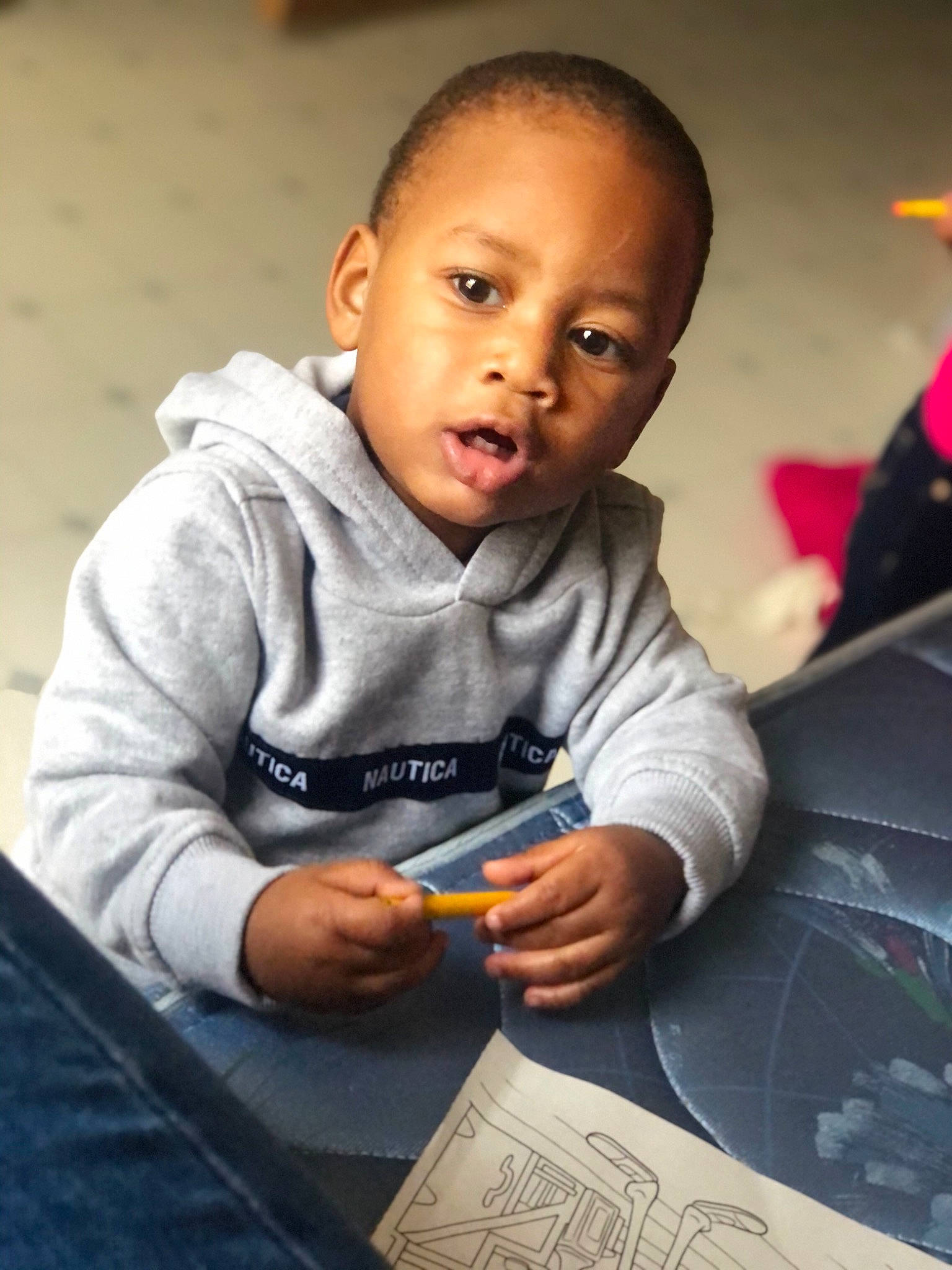 Sincere joined the competition — help win amazing prizes! baby, cheek, child, flash_photography, fun, happy, head, hoodie, people, person, play, portrait_photography, reading, room, sitting, smile, t_shirt, toddler, writing, writing_implement