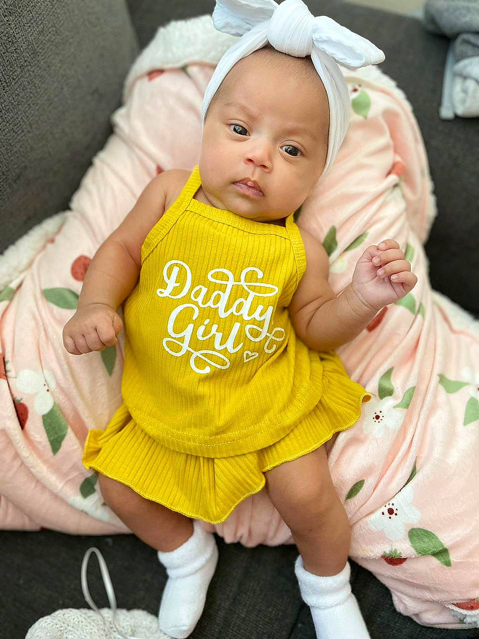 Alexandra joined the competition — help win amazing prizes! baby, baby_products, baby_toddler_clothing, cheek, child, dress, event, face, gesture, happy, human_body, person, pink, sitting, skin, sleeve, sock, t_shirt, toddler, white