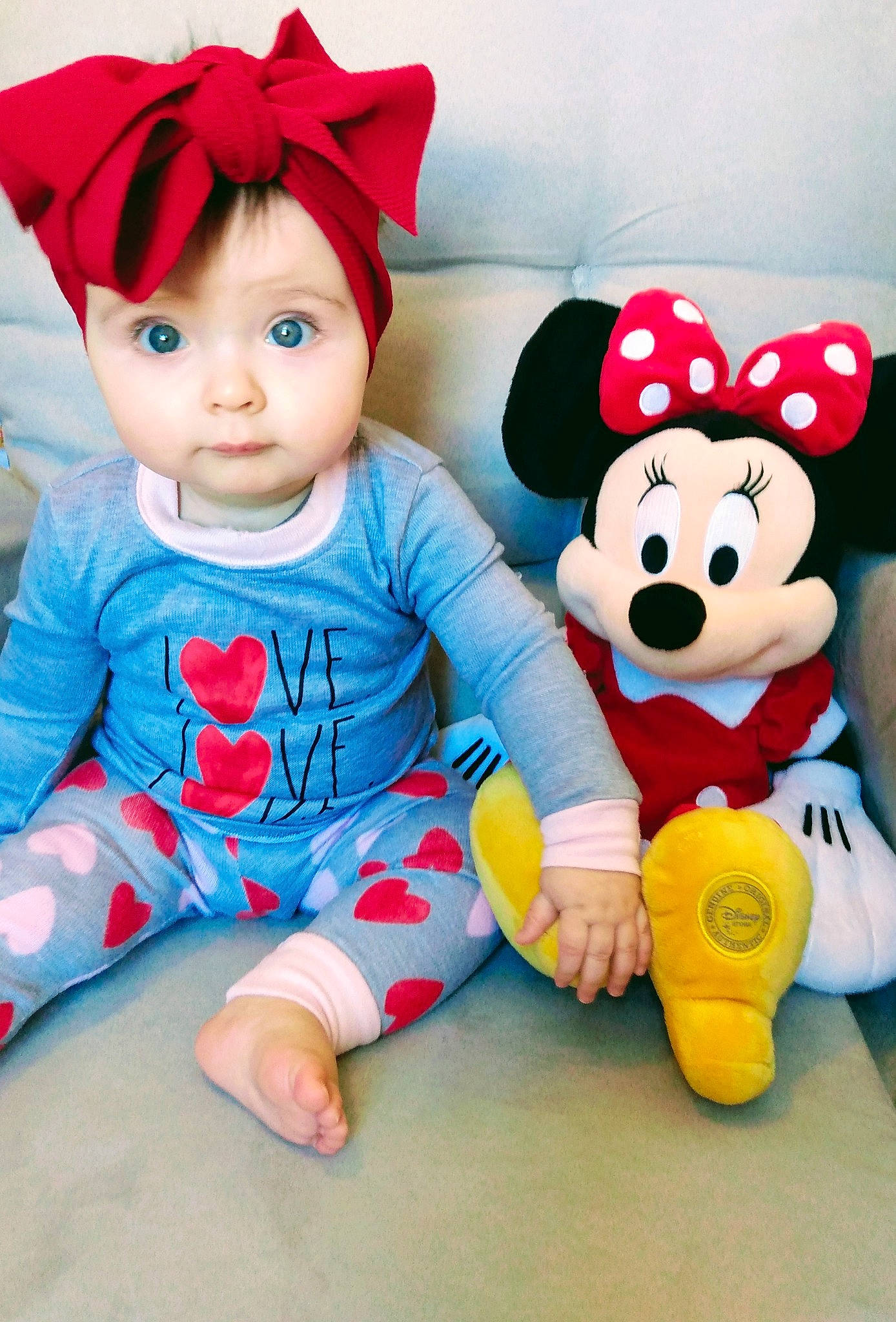 Amya is registered to the contest to win money with this photo: baby, baby_toddler_clothing, baby_toys, cap, cheek, doll, facial_expression, fun, happy, mammal, people, person, pink, plush, product, red, sleeve, stuffed_toy, textile, toy