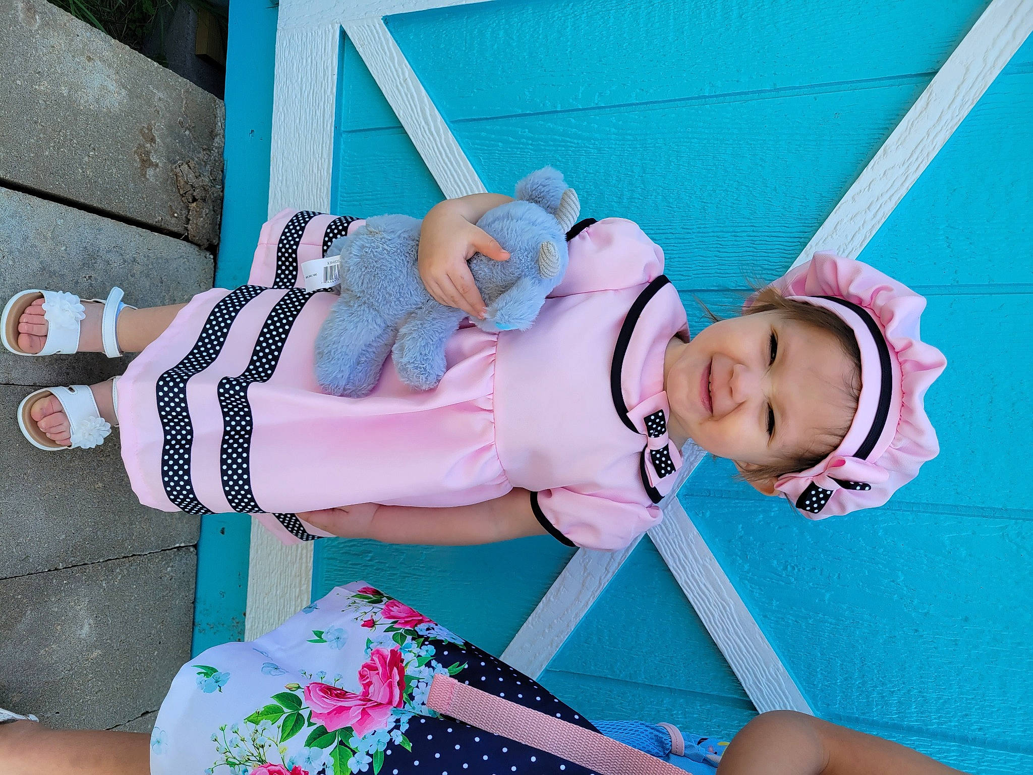 Emmy is registered to the contest to win money with this photo: baby, baby_products, baby_safety, baby_toddler_clothing, blue, child, comfort, costume, electric_blue, happy, hat, headwear, leisure, pattern, person, pink, sitting, sleeve, sock, thigh