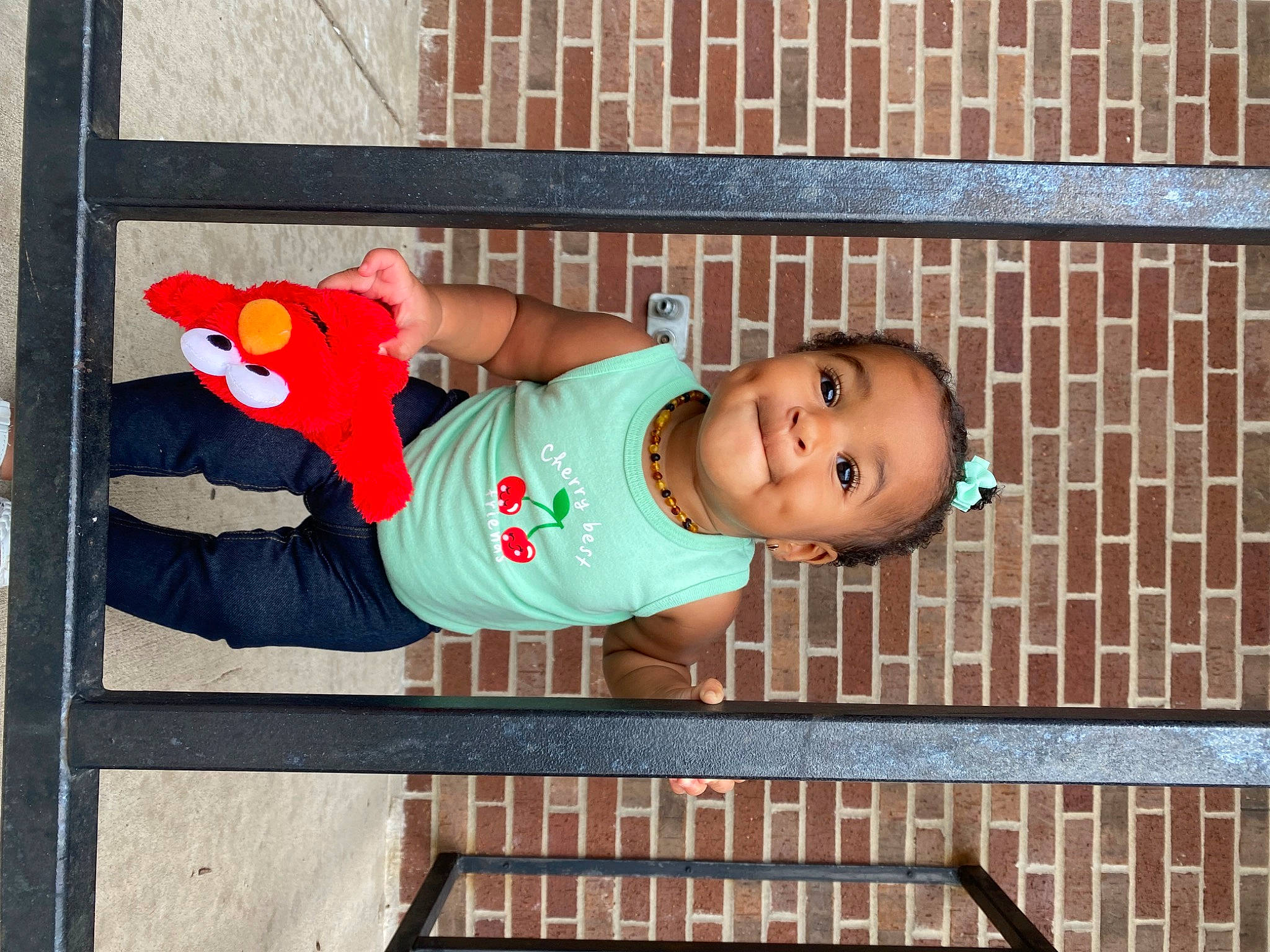 Leiana is registered to the contest to win money with this photo: baby, baby_laughing, baby_toddler_clothing, child, face, fun, happy, hat, house, leisure, people, person, smile, standing, toddler, wall, wood