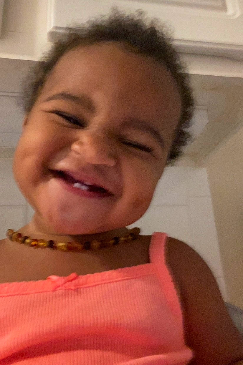 Leiana is registered to the contest to win money with this photo: baby_toddler_clothing, cheek, chin, eyelash, facial_expression, forehead, fun, gesture, happy, iris, jaw, joy, lip, mouth, nose, person, pink, skin, sleeve, smile