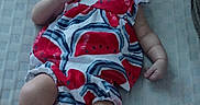 Lila joined the competition — help win amazing prizes! baby, infant, sleeping, pacifier, bow, headband, dress, watermelon, patterned_clothing, red, white, blue, sneakers, socks, lying_down, bed, blanket, portrait, indoors, child