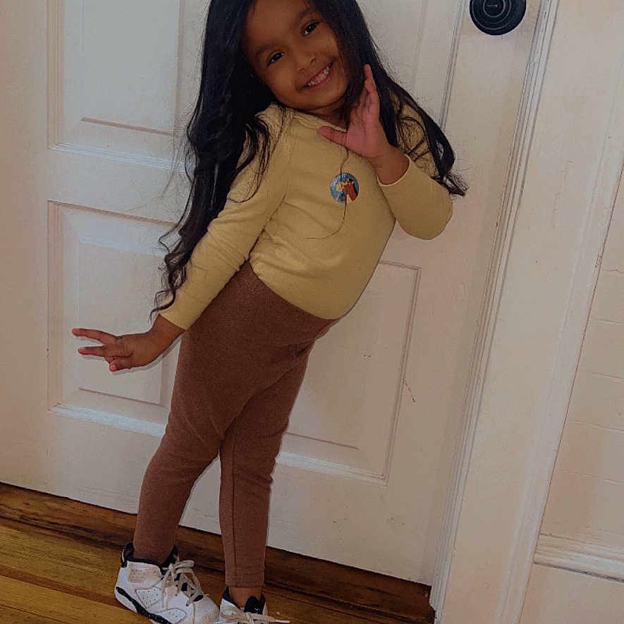 Avarose is registered to the contest to win money with this photo: clothing, door, face, female, footwear, girl, hardwood, head, indoors, longsleeve, pants, person, photography, portrait, runningshoe, shoe, sleeve, sneaker, teen, wood