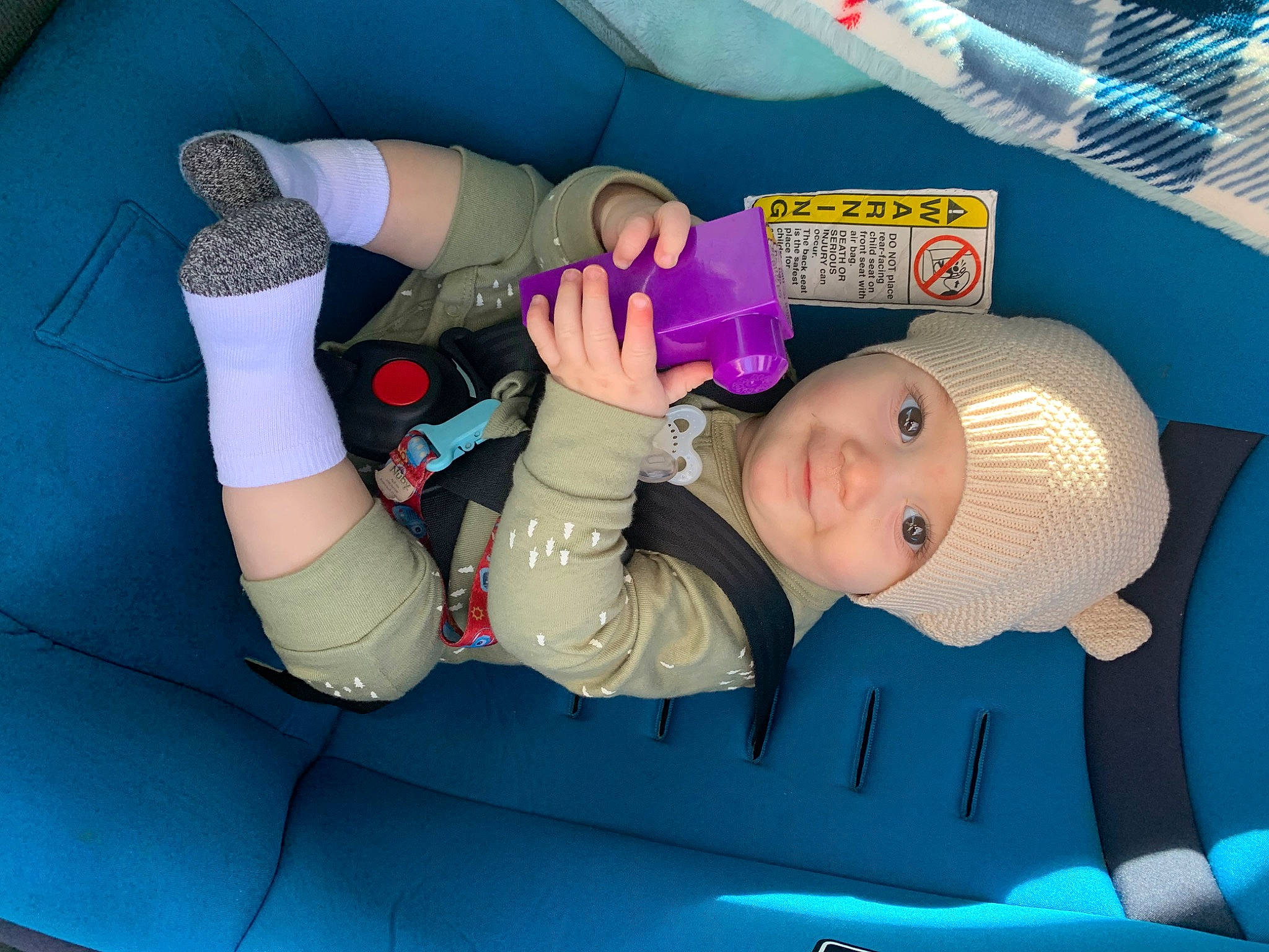 Deklan is registered to the contest to win money with this photo: baby, baby_products, baby_toddler_clothing, car_seat, child, comfort, elbow, foot, fun, gesture, headgear, headwear, human_leg, joy, knee, leisure, mouth, nail, person, plastic