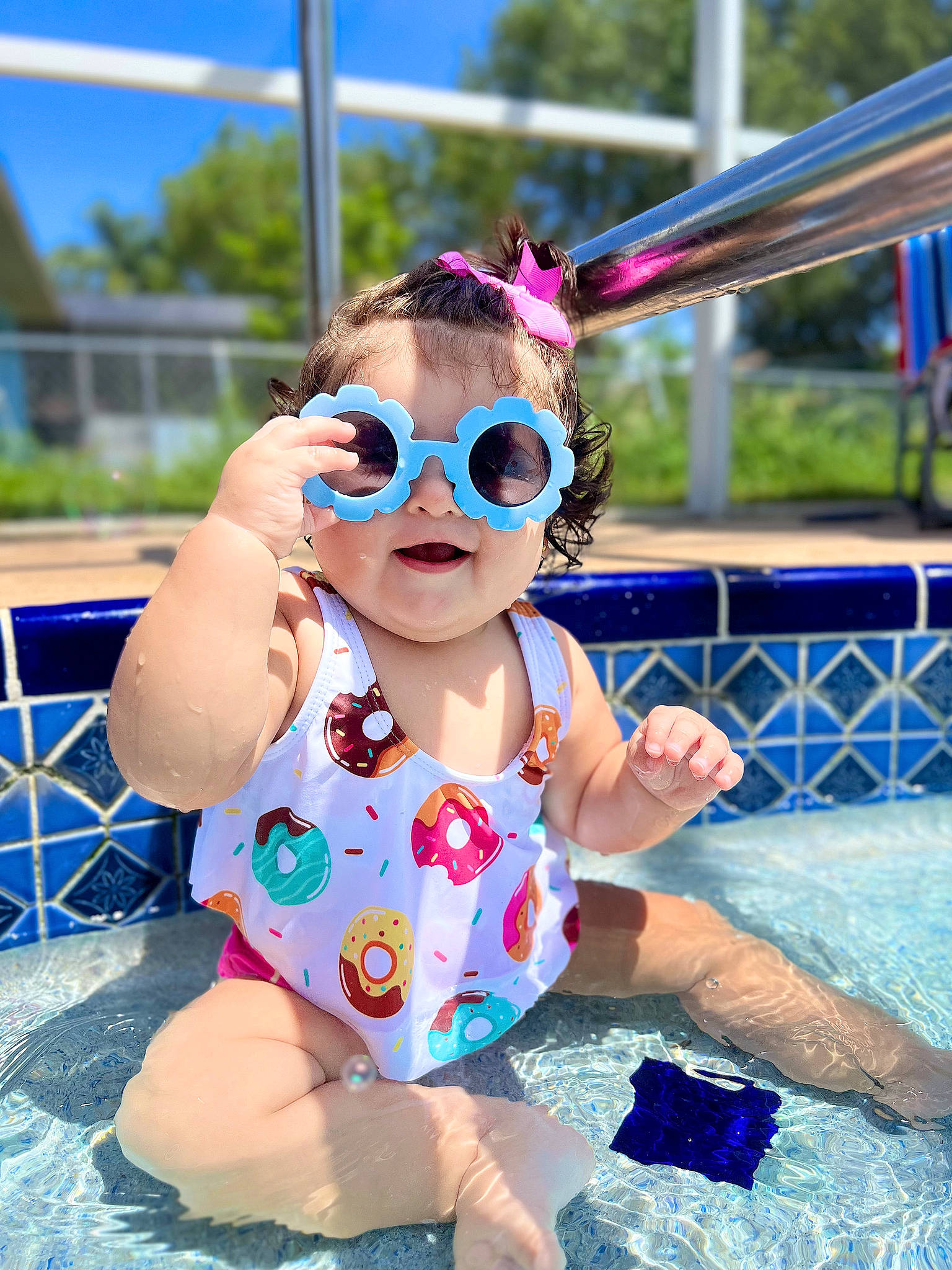 Alaia joined the competition — help win amazing prizes! baby, baby_toddler_clothing, blue, cool, eyewear, goggles, grass, happy, headgear, leisure, person, personal_protective_equipment, pink, recreation, sky, summer, sunglasses, toddler, vision_care, water