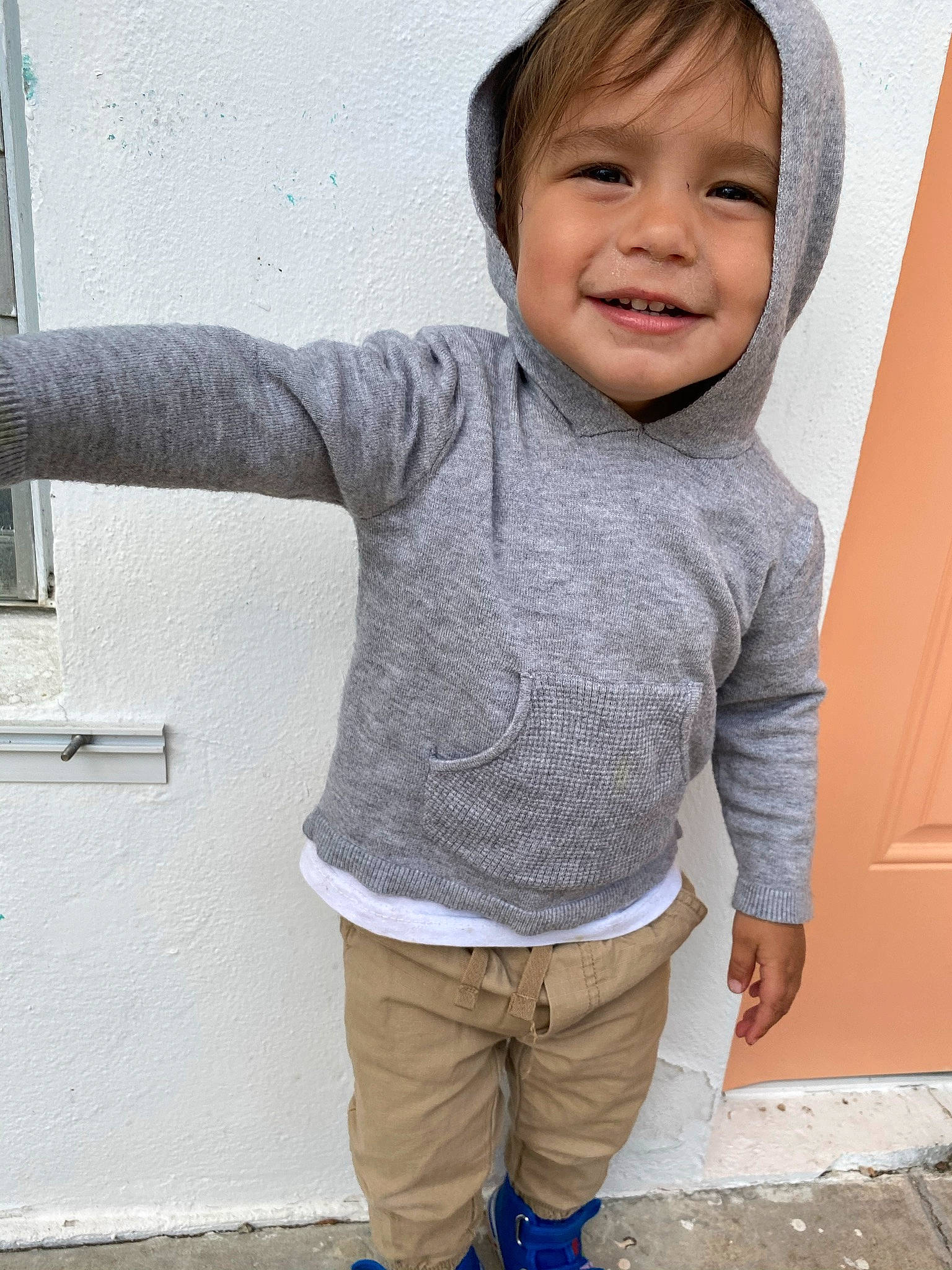 Jahsiah joined the competition — help win amazing prizes! arm, baby_toddler_clothing, eye, face, gesture, grey, hand, happy, human_body, joy, neck, nose, outerwear, person, photograph, shoulder, sleeve, smile, standing, thumb