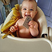 Joshua participe au concours pour gagner de l'argent avec cette photo : baby, high_chair, blue_eyes, smiling, plush_toy, yellow_bunny, card, number_9, indoor, child, cute, cheerful, furniture, person, seat, happy, skin, hand, head, toy