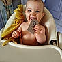 baby, high_chair, blue_eyes, smiling, plush_toy, yellow_bunny, card, number_9, indoor, child, cute, cheerful, furniture, person, seat, happy, skin, hand, head, toy