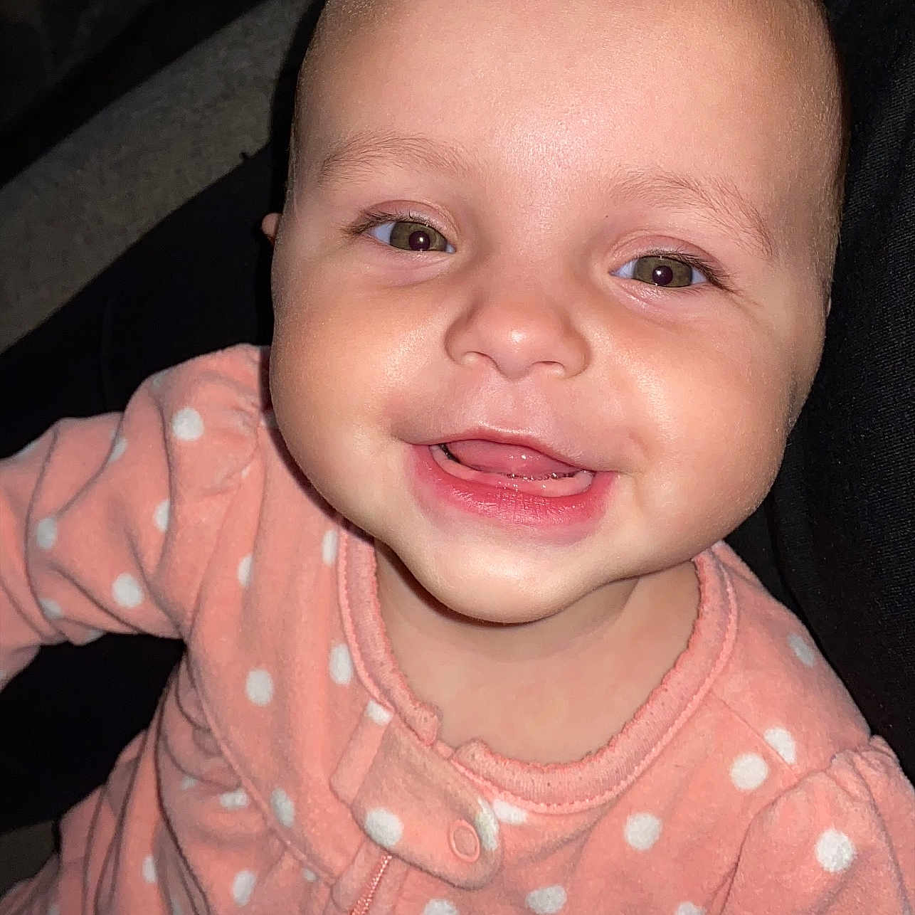 Elena is registered to the contest to win money with this photo: baby, child, smiling, face, onesie, polka_dot, pink_clothing, infant, cute, portrait, happy, closeup, person, indoors, young_child, head, skin, eyes, mouth, teeth