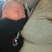 Kenneth joined the competition — help win amazing prizes! baby, newborn, sleeping_baby, infant, adult, scarf, cuddling, close_up, portrait, family, holding, cozy, clothing, ring, hand, indoor, cheeks, peaceful, resting, skin