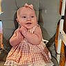 baby, child, dress, headband, chair, cushion, clapping, happy, indoors, smiling, person, cute, infant, seated, pink, skin, young, furniture, portrait, baby_girl