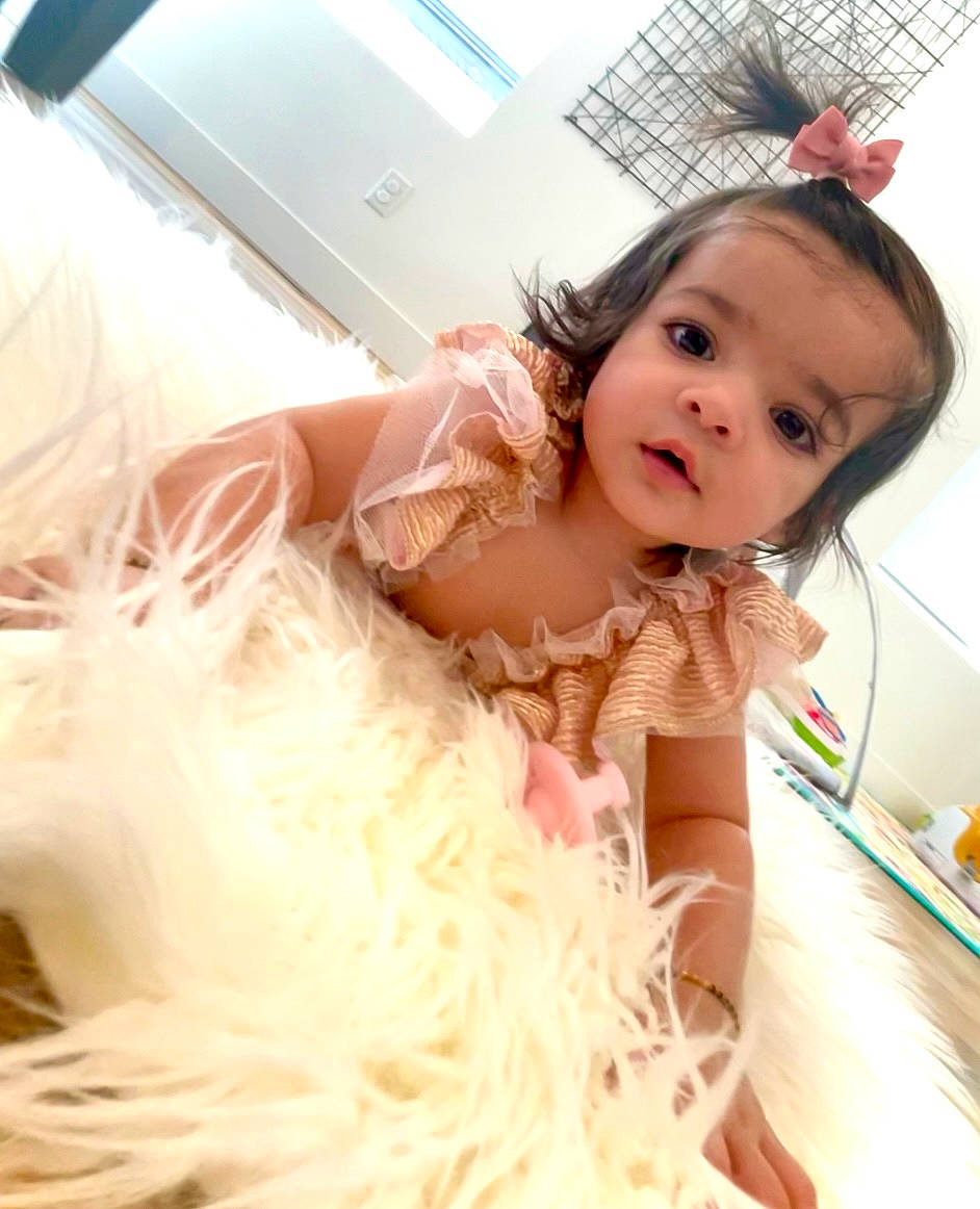 Anaya is registered to the contest to win money with this photo: bathing, bridal_accessory, bridal_clothing, child, dress, event, eyelash, fashion_accessory, fashion_design, flash_photography, flooring, formal_wear, hair_accessory, happy, headgear, headpiece, long_hair, peach, person, skin