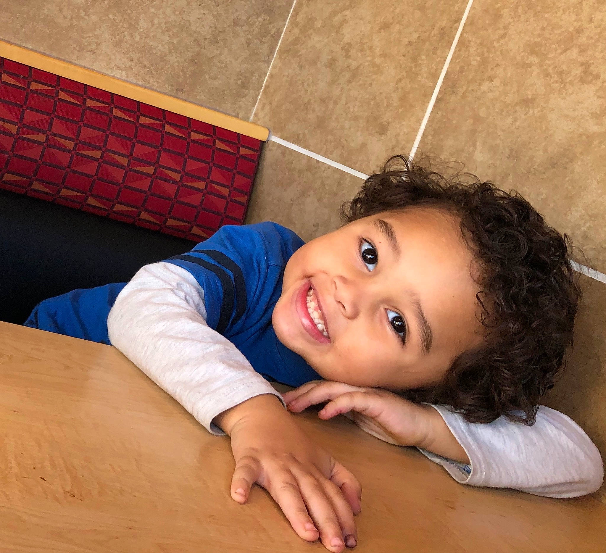 Jamarion is registered to the contest to win money with this photo: arm, beauty, black_hair, child, face, finger, floor, flooring, head, joint, leg, mouth, muscle, neck, person, skin